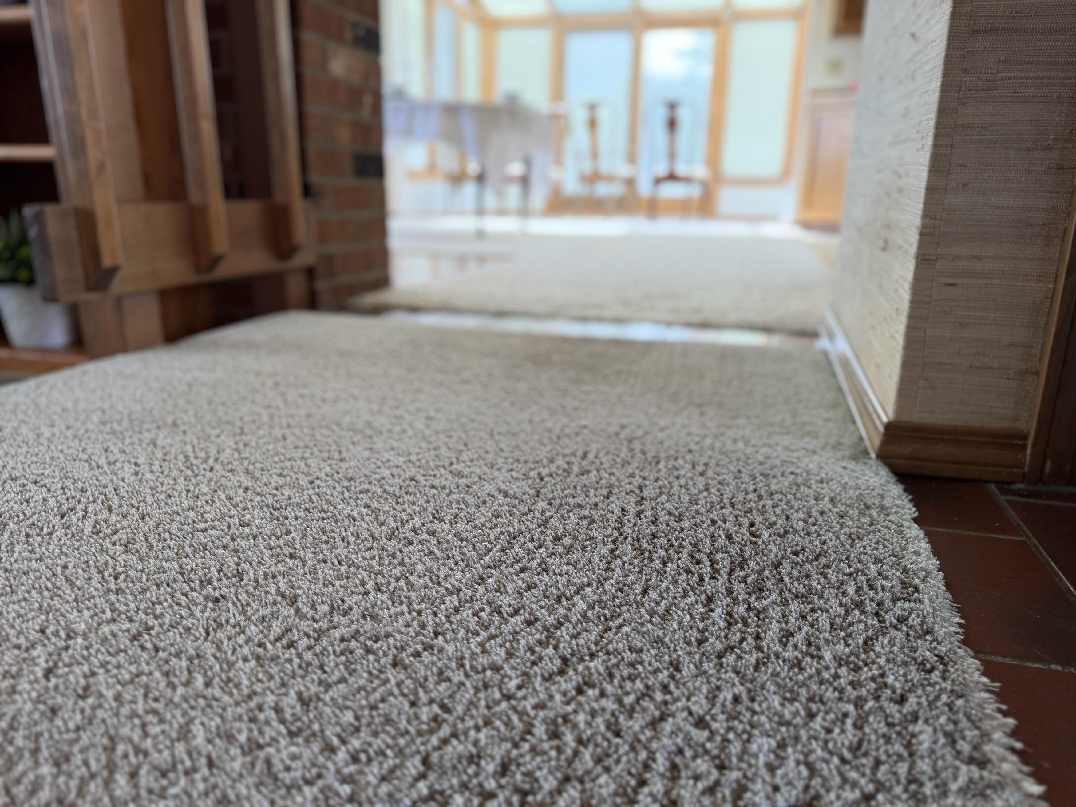 Close-up of clean beige carpet fibers
